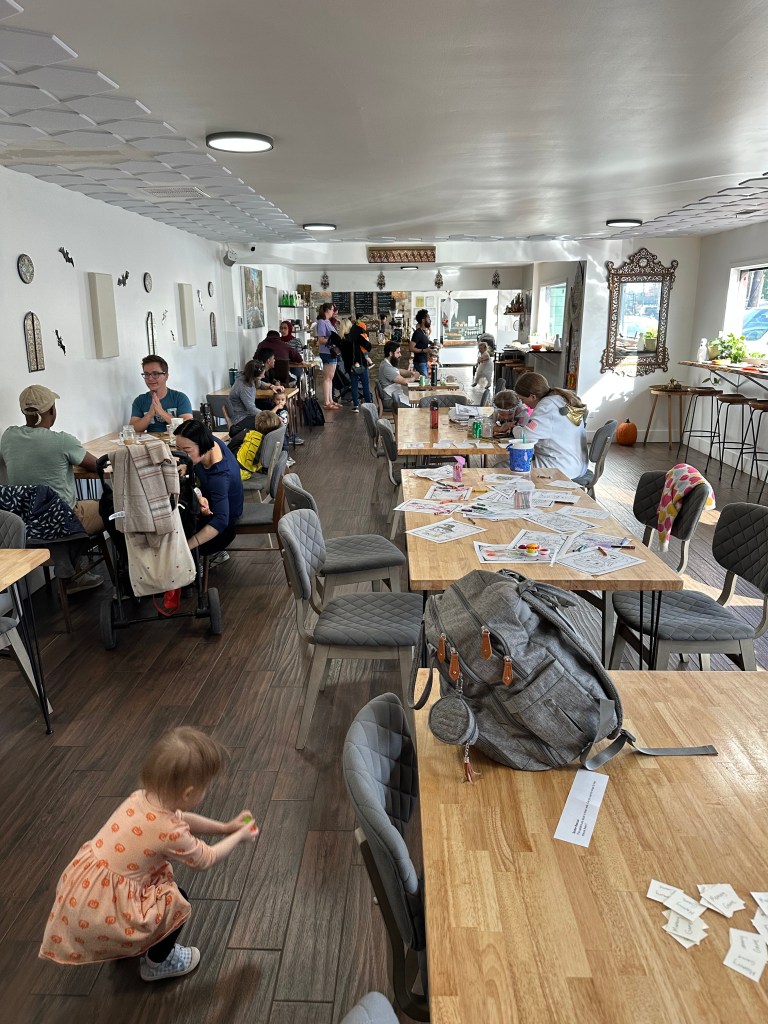 Families having fun during Mint Coffeehouse's community halloween party