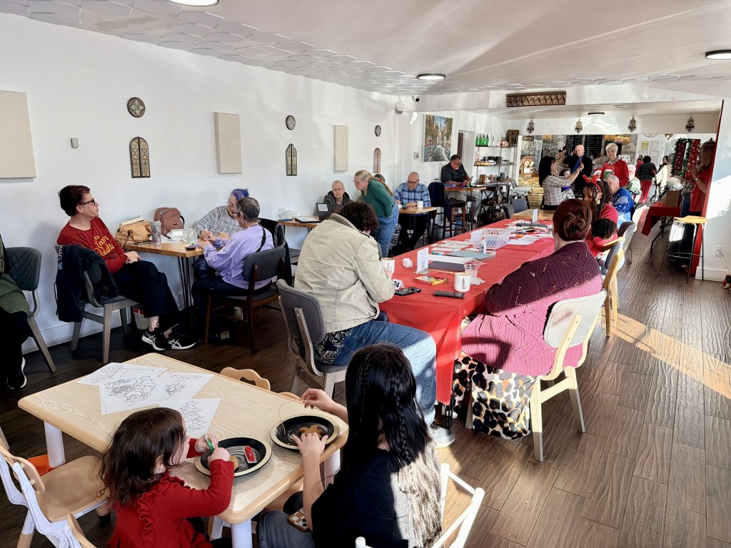 Community members enjoying Mint Coffeehouse's Community Christmas Party